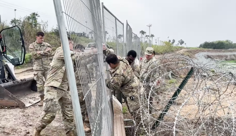 Texas National Guard soldiers install new anti-climb fencing near Brownsville in early December 2023.